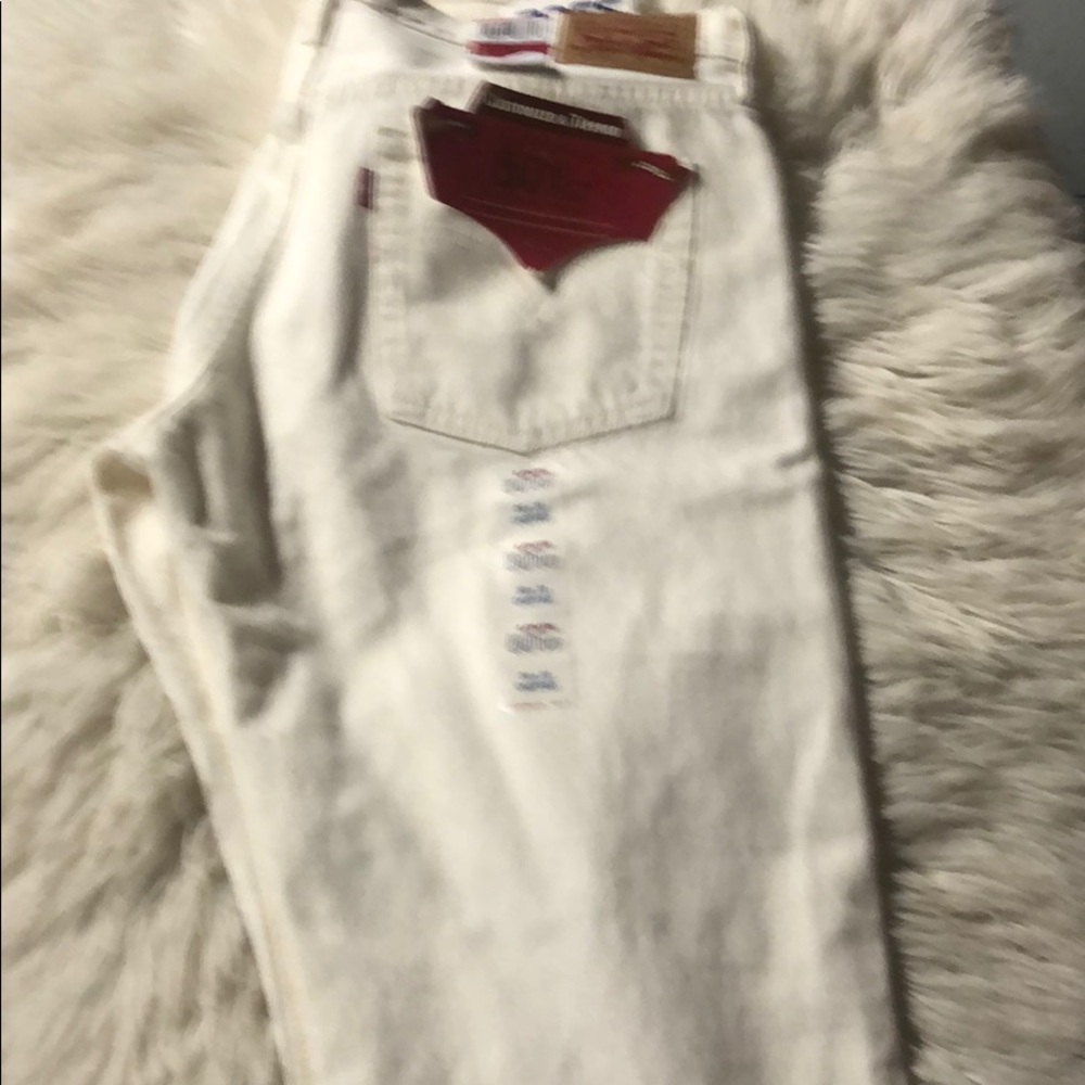 Levi’s 501 tapered leg distressed white jeans